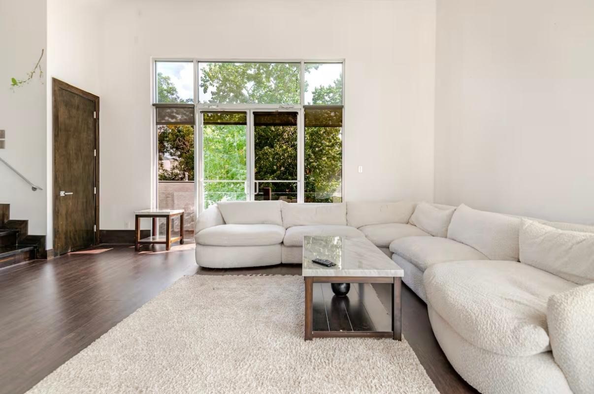 4118 Floyd Street, Unit A Houston, TX 77007 - Photo 6 of 25 a living room with furniture and a large window