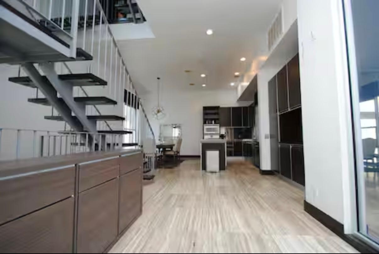 4118 Floyd Street, Unit A Houston, TX 77007 - Photo 8 of 25 a view of a kitchen with cabinets and stainless steel appliances