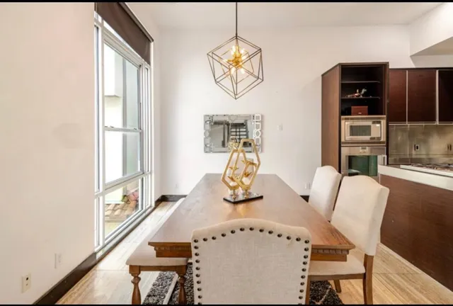 a living room with furniture fireplace and window