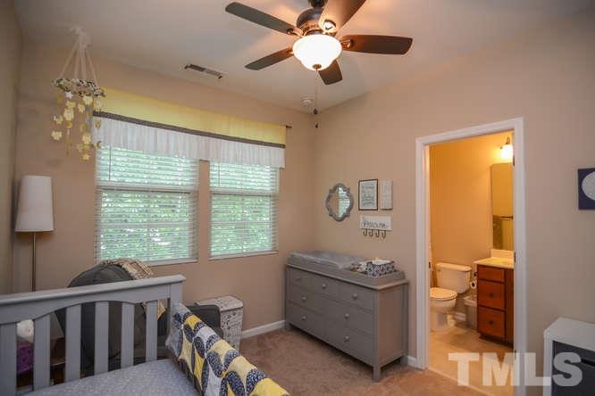 720 Wickham Ridge Road Apex, NC 27539 - Photo 10 of 21 On the opposite end of the hallway is the 2nd bedroom with an attached full bath. This could be a great guest suite, if needed.
