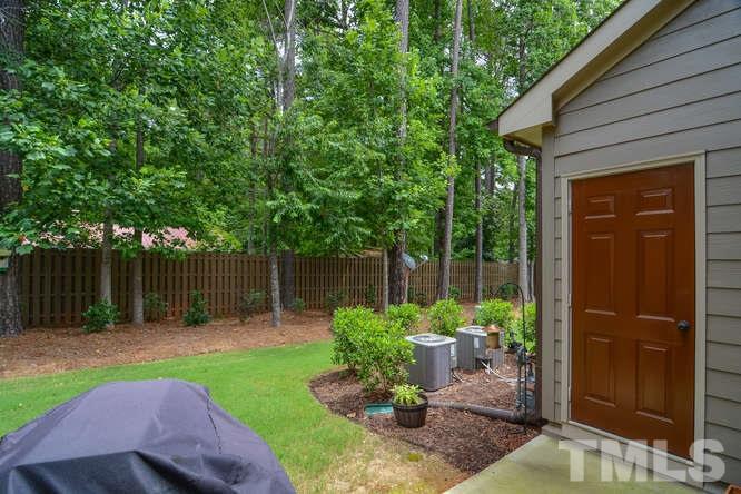 720 Wickham Ridge Road Apex, NC 27539 - Photo 13 of 21 Just off of the kitchen is the patio and backyard space. How pretty! The door on the right is a closet which houses the hot water heater and provides space for storage.
