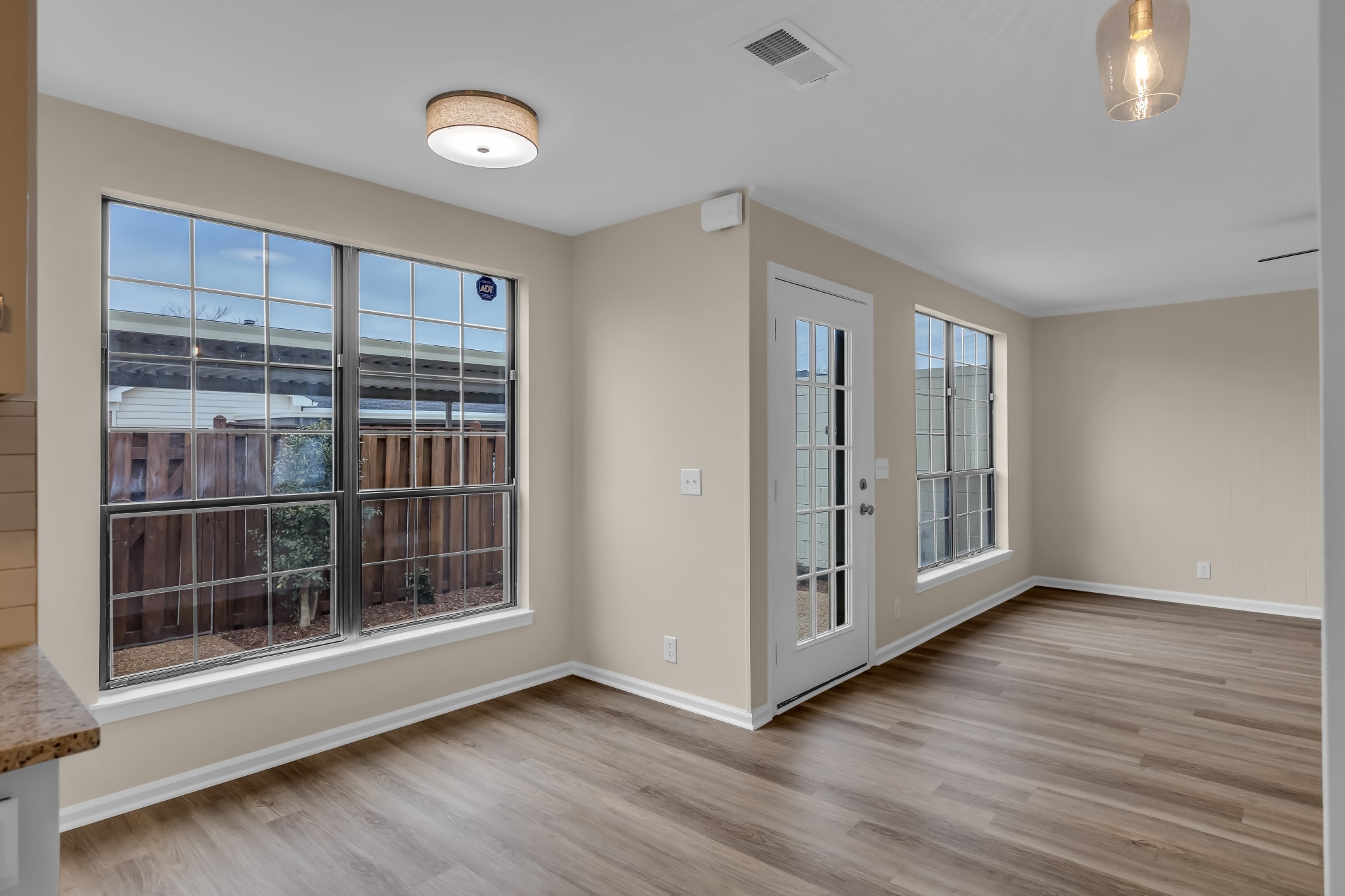 1205 General George Patton Road Nashville, TN 37221 - Photo 12 of 32 a view of an empty room with wooden floor and a window