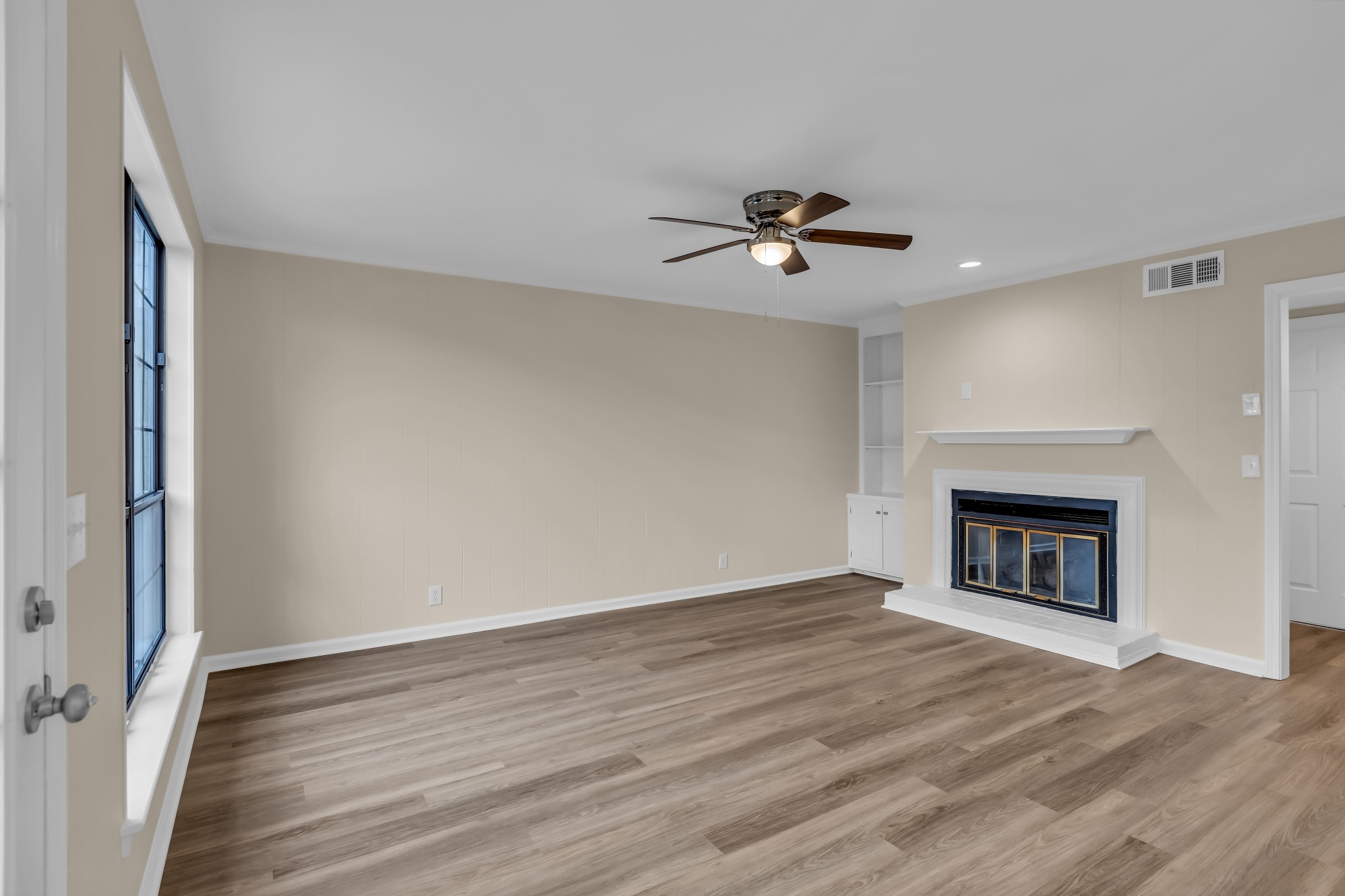 1205 General George Patton Road Nashville, TN 37221 - Photo 14 of 32 a view of an empty room with a fireplace and a window