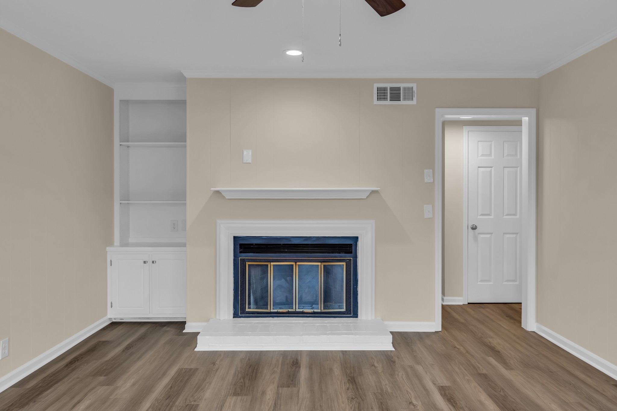 1205 General George Patton Road Nashville, TN 37221 - Photo 15 of 32 a view of an empty room with wooden floor and a fireplace