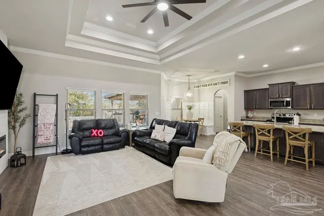 a living room with furniture and a flat screen tv