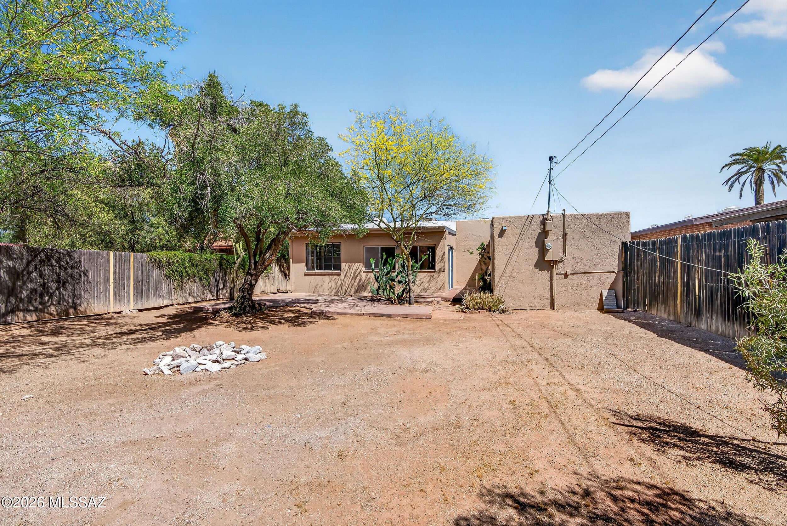 1412 East Spring Street Tucson, AZ 85719 - Photo 37 of 43 a view of a house with backyard and a tree