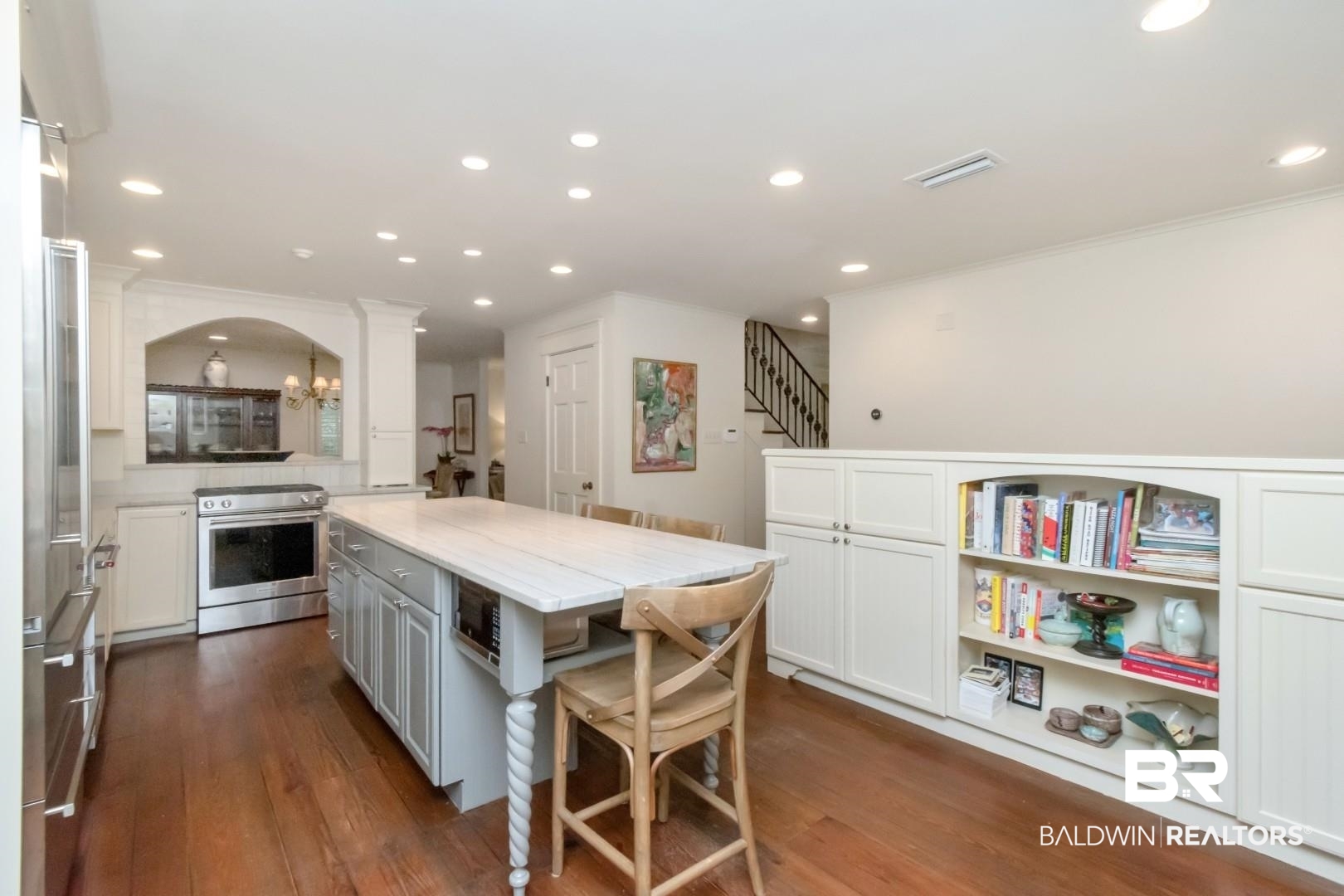 4810 Mums Court Mobile, AL 36608 - Photo 13 of 50 Kitchen featuring stainless steel appliances, dark wood finished floors, a kitchen island, recessed lighting, and white cabinetry