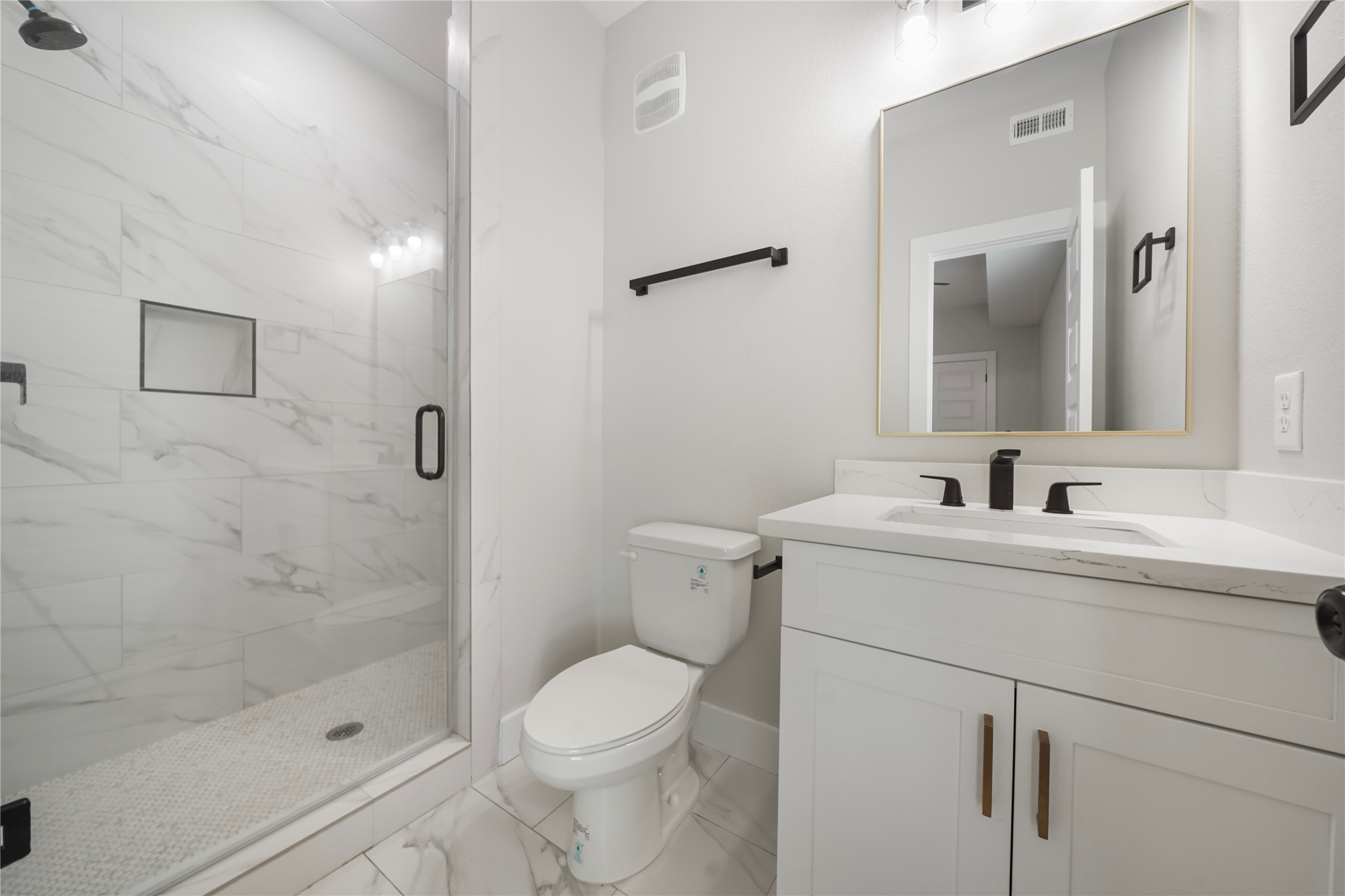 402 East 37th Street, Unit A Houston, TX 77018 - Photo 7 of 10 a bathroom with a sink a toilet and shower
