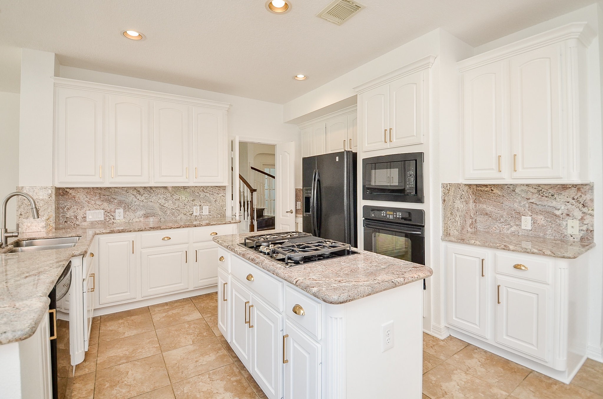 5615 Bent Arbor Lane Katy, TX 77450 - Photo 12 of 42 The lease includes this refrigerator, plus the washer and dryer in the utility room. Other appliances are an electric oven, microwave, dishwasher and the gas cooktop on the island.