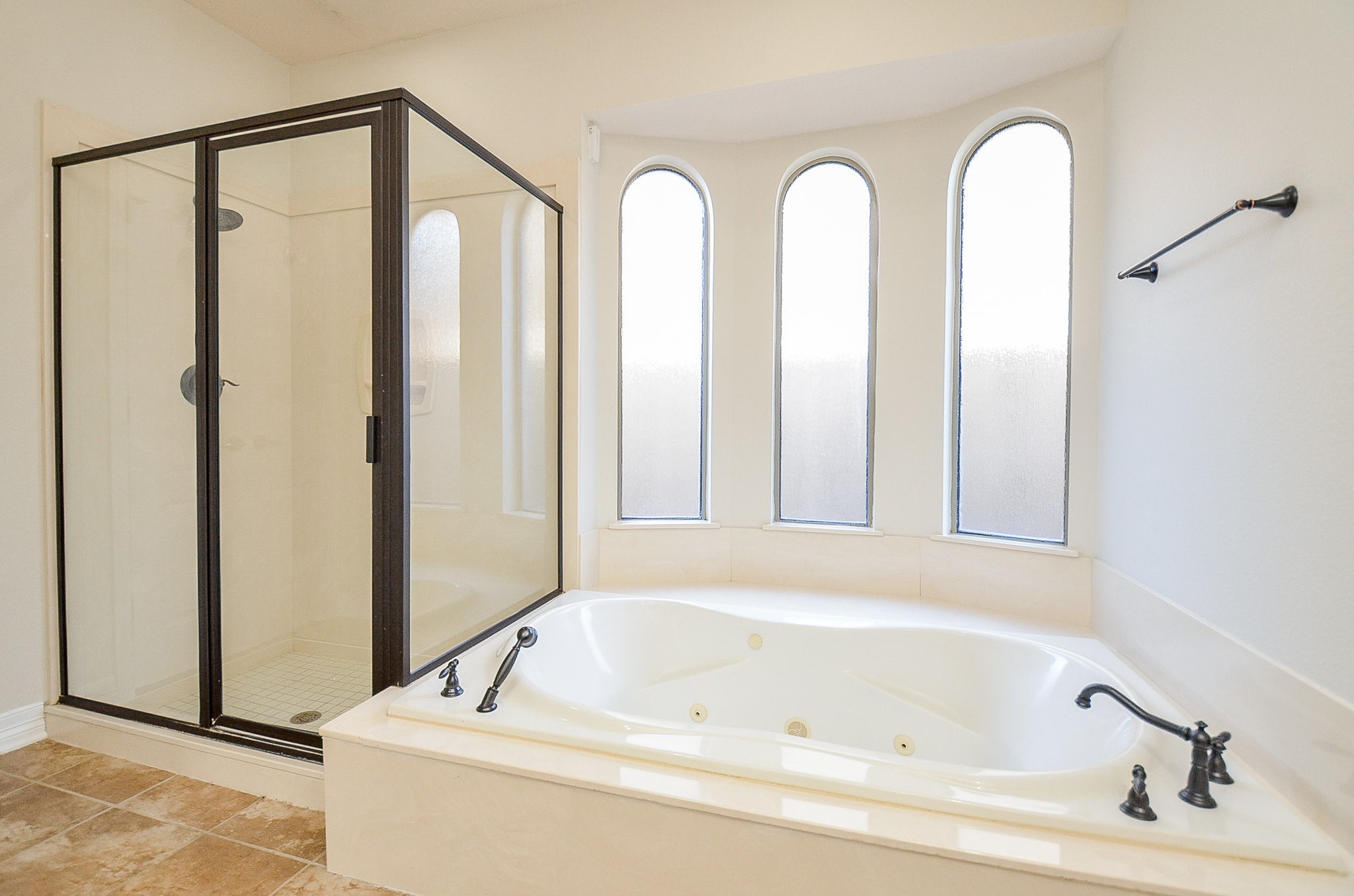 5615 Bent Arbor Lane Katy, TX 77450 - Photo 20 of 42 Master bathroom has a separate shower and oversized tub with hand sprayer. Privacy rain glass offers natural light.