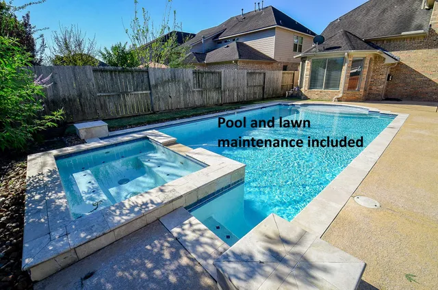 front view of house with swimming pool and porch