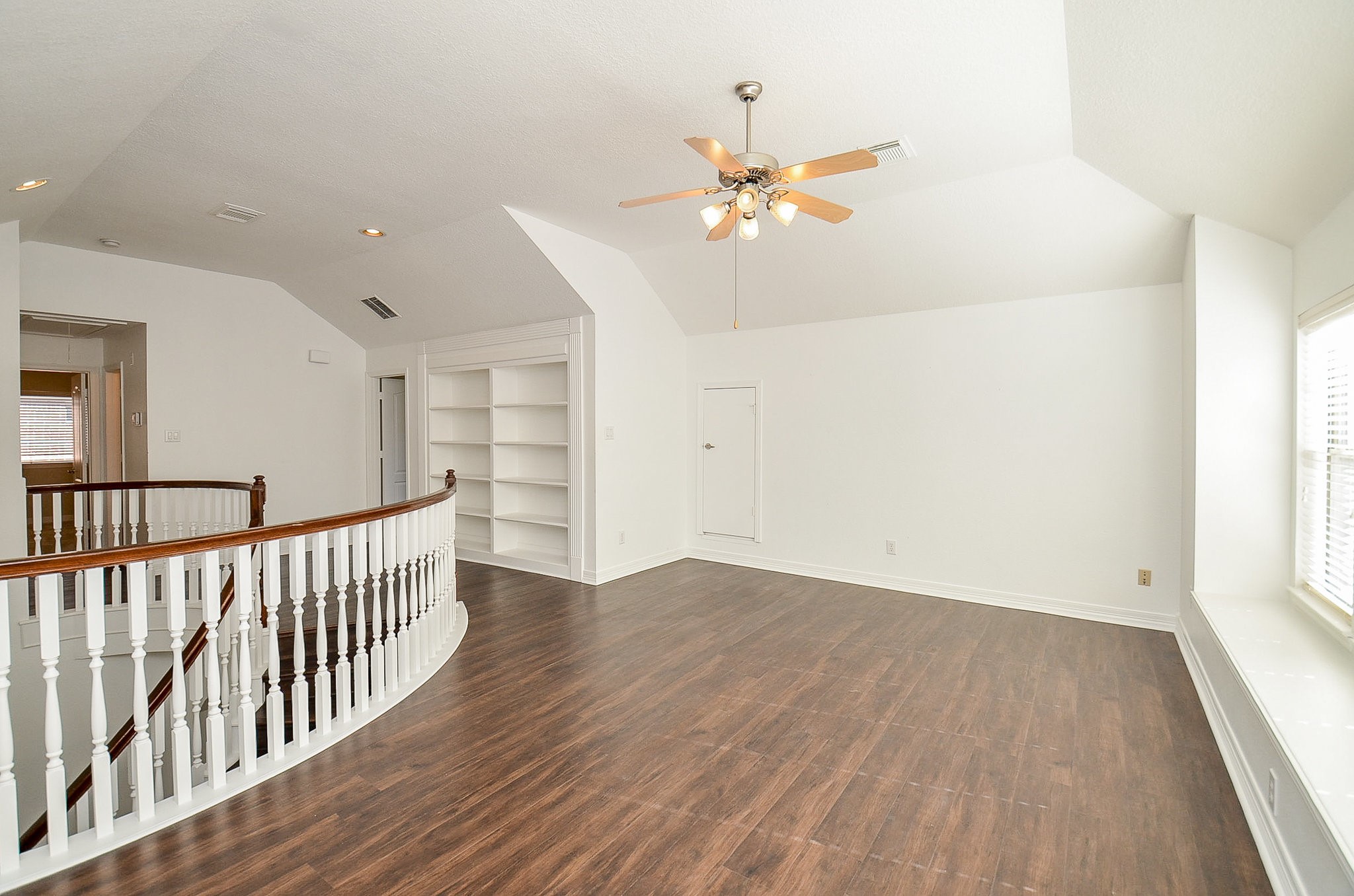 5615 Bent Arbor Lane Katy, TX 77450 - Photo 22 of 42 wooden floor in an empty room with a window