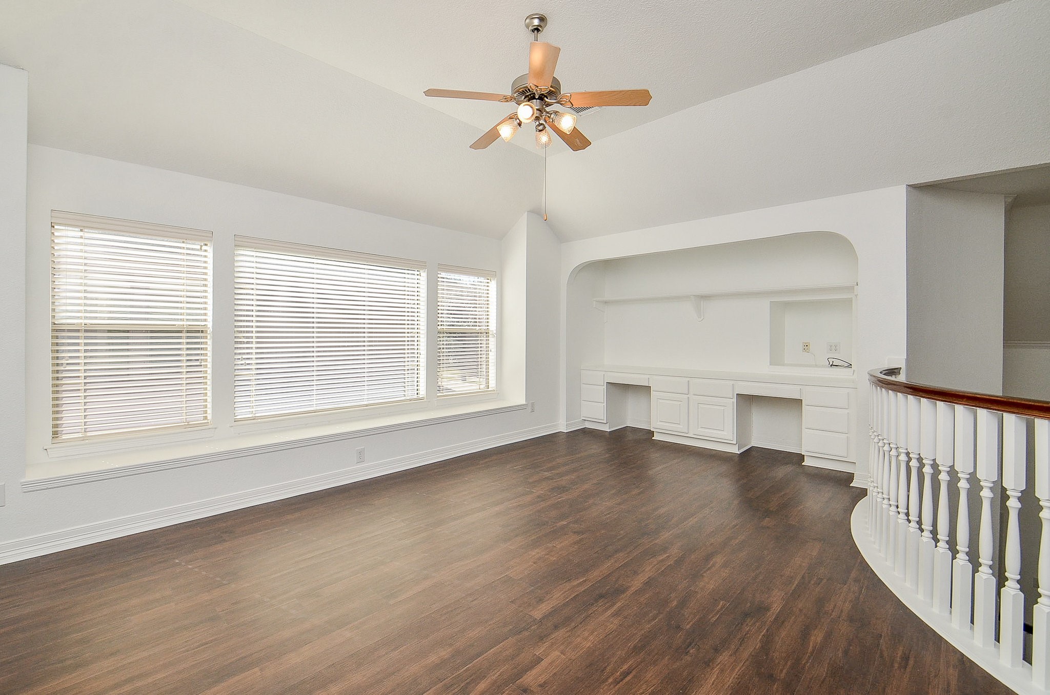 5615 Bent Arbor Lane Katy, TX 77450 - Photo 24 of 42 Another view of the gameroom with a long window seat and computer work area. Luxury vinyl plank has replaced this carpeting.