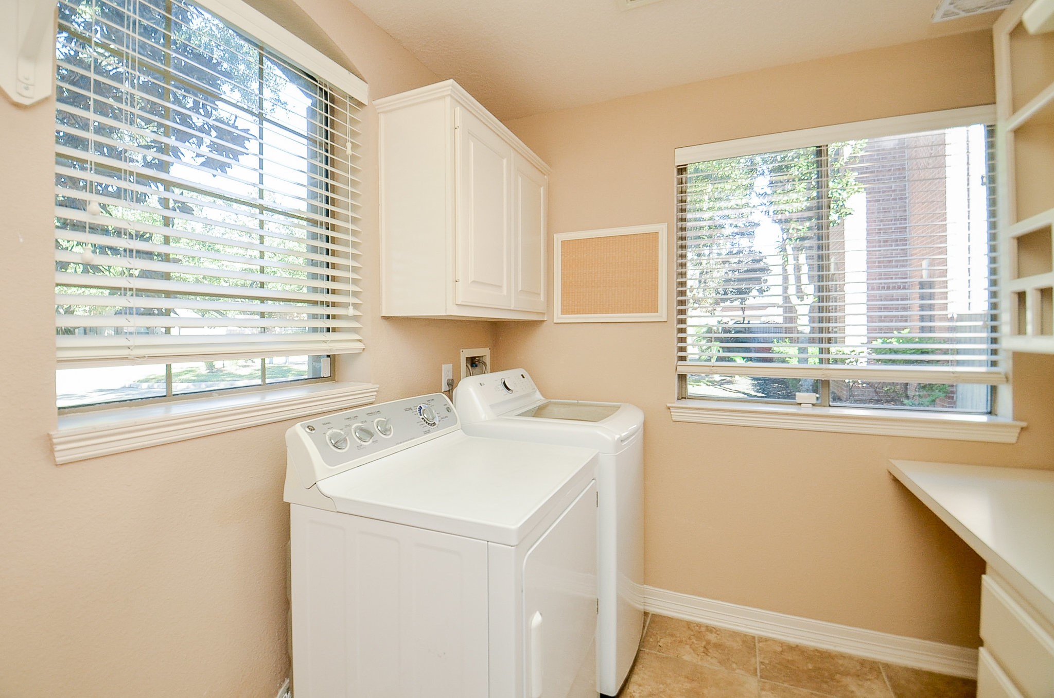 5615 Bent Arbor Lane Katy, TX 77450 - Photo 31 of 42 a utility room with dryer and washer
