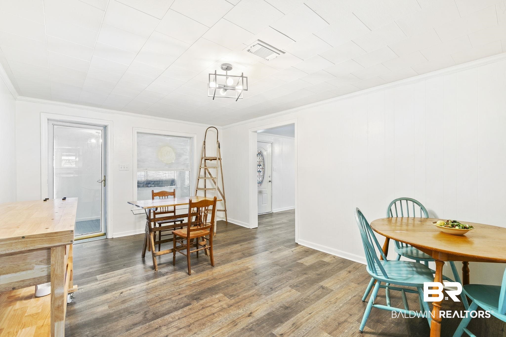 316 West Orchid Avenue Foley, AL 36535 - Photo 15 of 38 Dining space with wood finished floors and ornamental molding