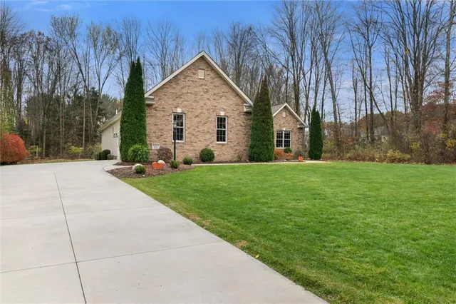 a front view of a house with yard