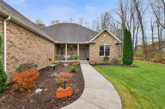 a front view of a house with garden