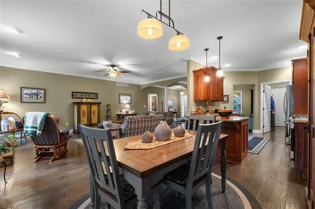 a view of a dining area with furniture and wooden floor