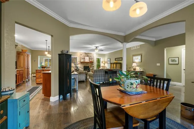 a view of a dining table and chairs in a room
