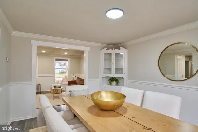 a living room with a couch and a potted plant