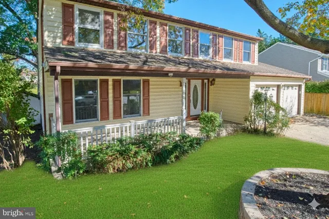 a view of a house with garden and plants