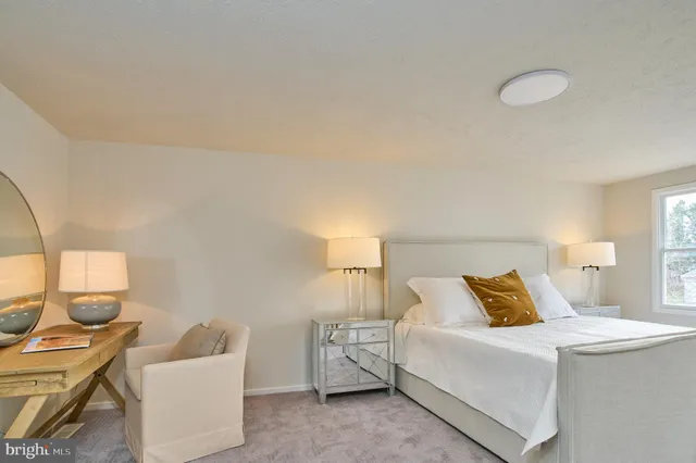 a bedroom with a bed and a couch