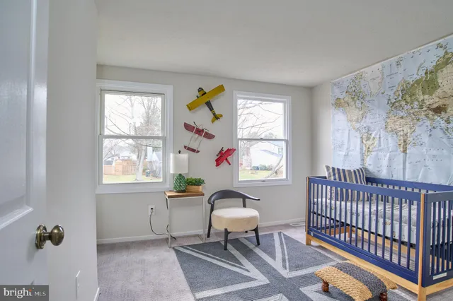 a workspace with wooden floor and a window