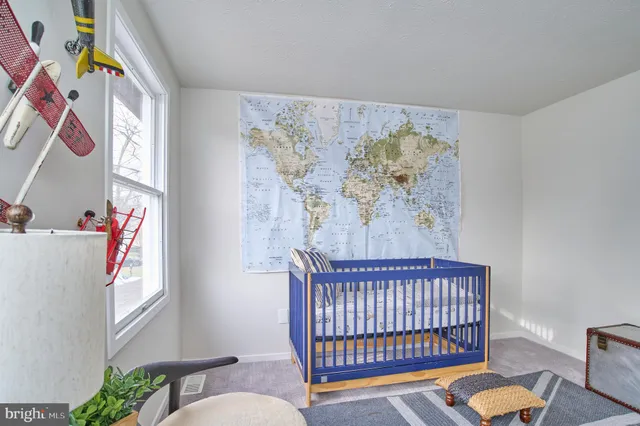 a bedroom with furniture and window