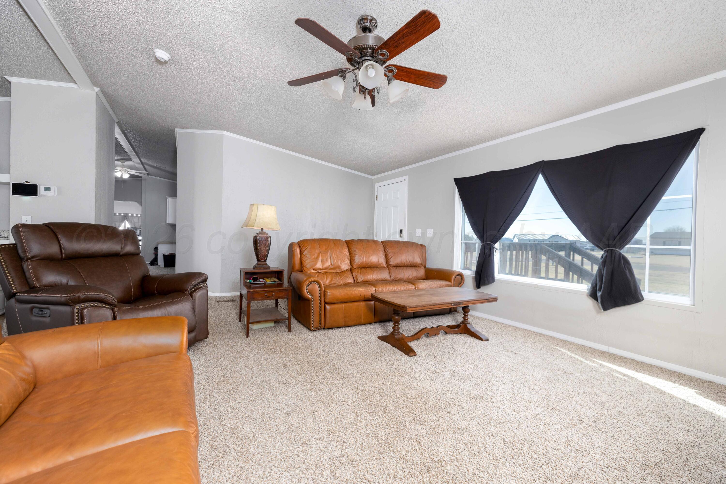 5410 Tranquility Road Amarillo, TX 79118 - Photo 11 of 37 a living room with furniture and a window