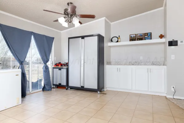 wooden floor with a cabinet and a flat screen tv