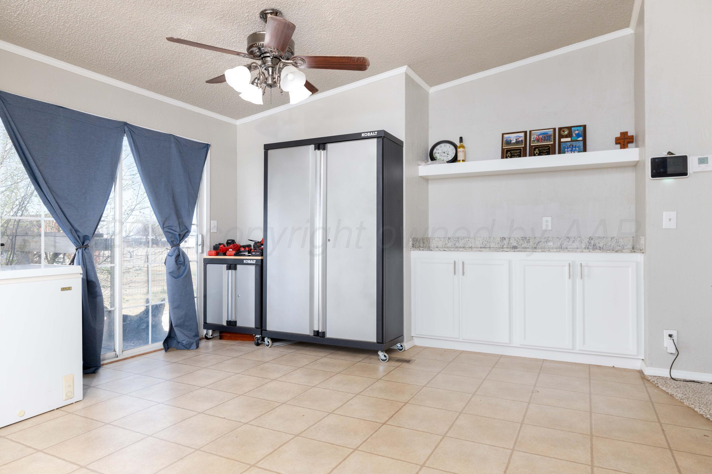 5410 Tranquility Road Amarillo, TX 79118 - Photo 17 of 37 a view of kitchen with furniture and ceiling fan