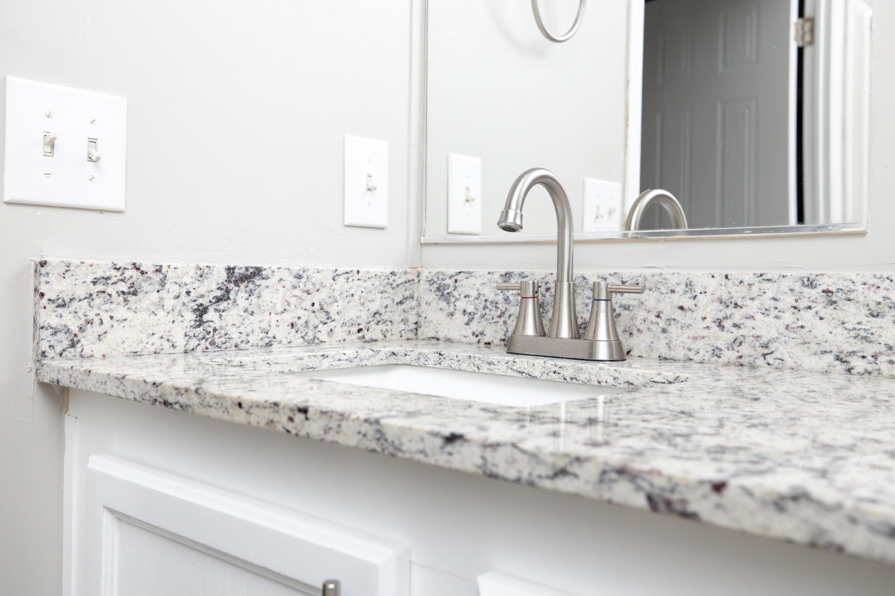 5410 Tranquility Road Amarillo, TX 79118 - Photo 22 of 37 a close view of sink and tap