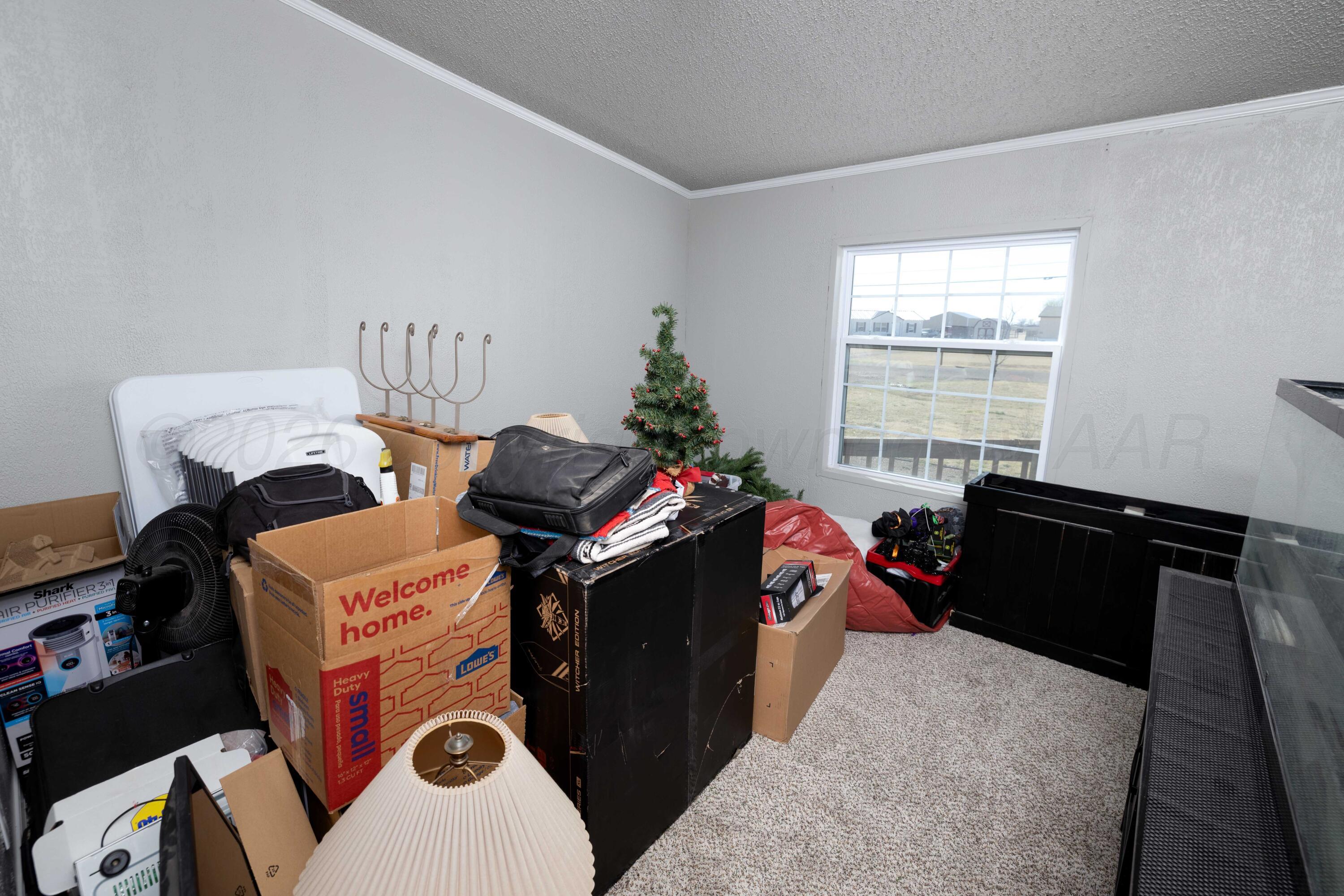 5410 Tranquility Road Amarillo, TX 79118 - Photo 31 of 37 a bed room with a bed and a window
