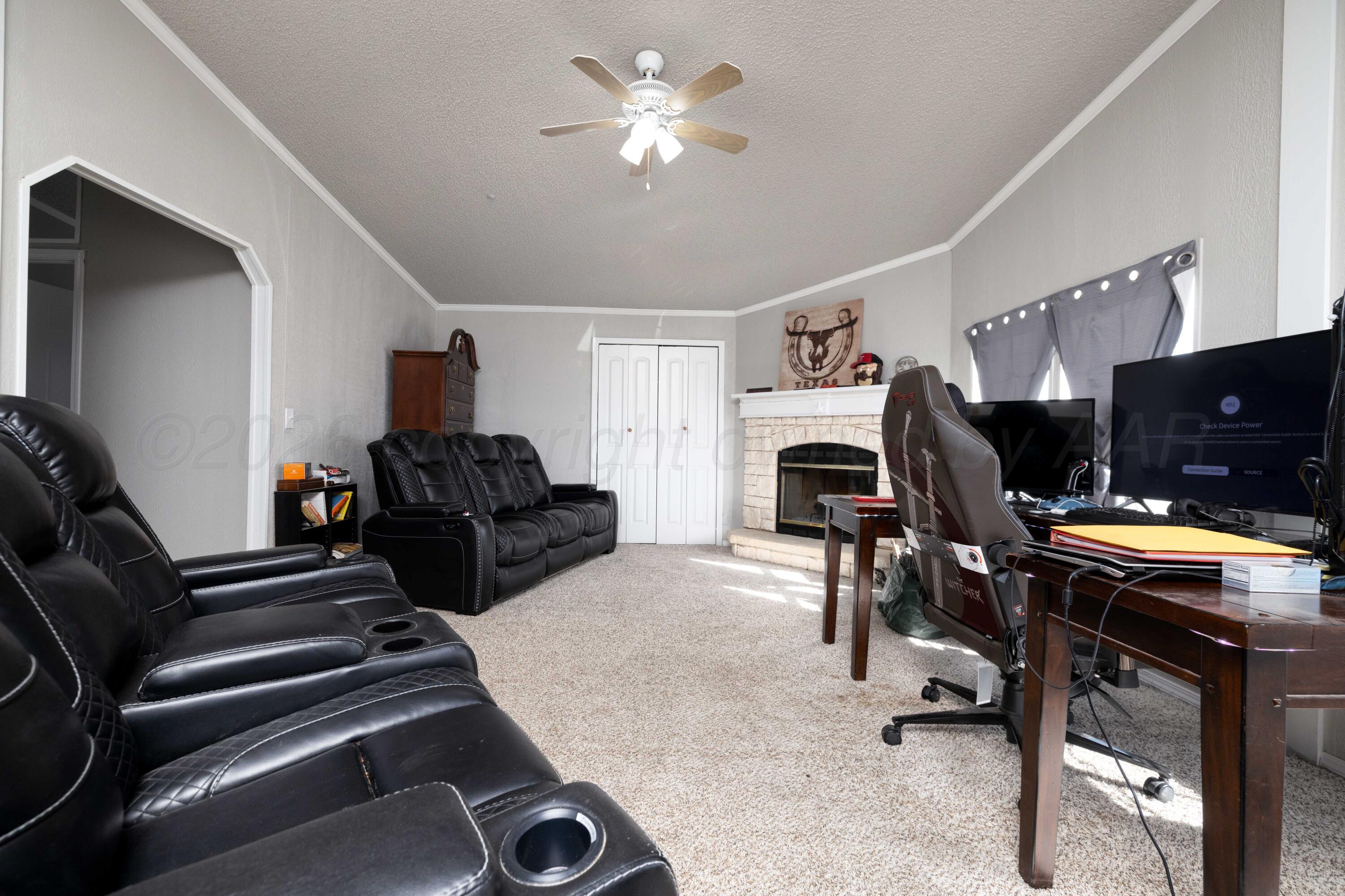5410 Tranquility Road Amarillo, TX 79118 - Photo 37 of 37 a view of a livingroom with furniture and a ceiling fan