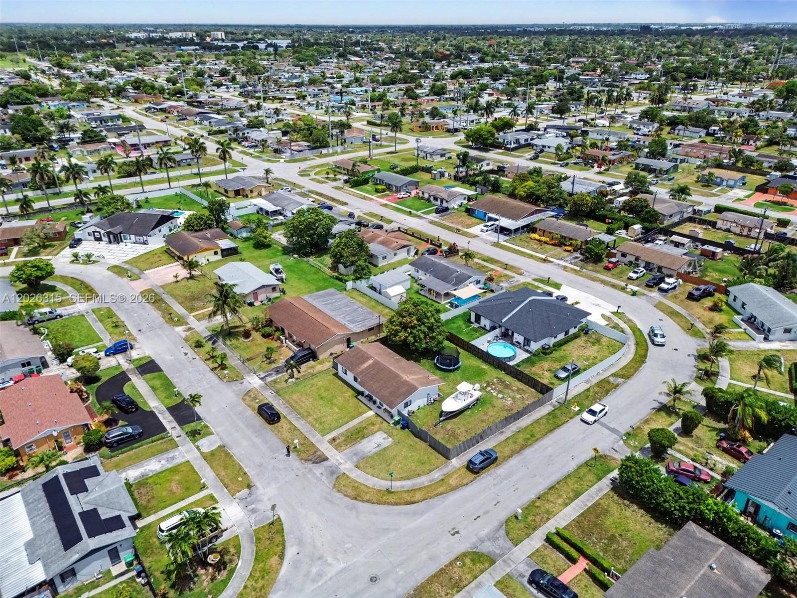 10762 Southwest 145th Street Miami, FL 33176 - Photo 4 of 28 an aerial view of residential houses with outdoor space