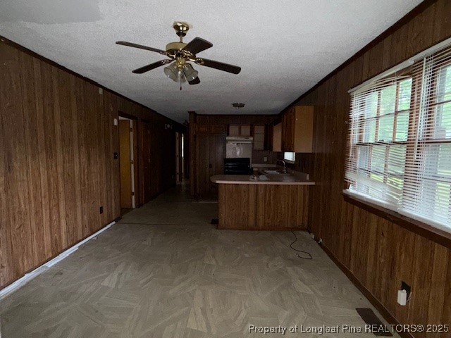 102 Little Street Rockingham, NC 28379 - Photo 11 of 29 a kitchen with stainless steel appliances kitchen island granite countertop a refrigerator a sink dishwasher a stove and a microwave oven