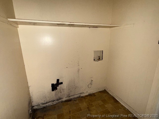 102 Little Street Rockingham, NC 28379 - Photo 12 of 29 a view of a room with racks on the wall