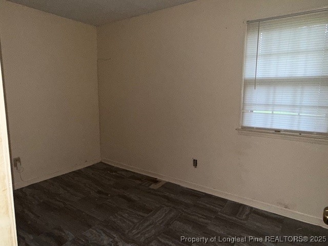 102 Little Street Rockingham, NC 28379 - Photo 18 of 29 a view of a small space with wooden floor and a window
