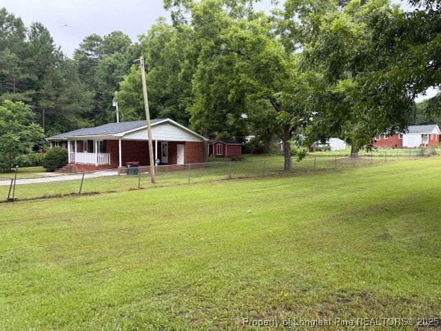 102 Little Street Rockingham, NC 28379 - Photo 2 of 29 a front view of a house with a yard