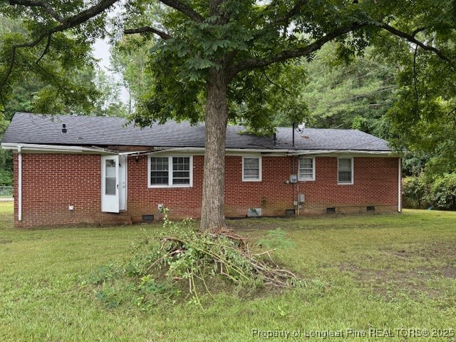 102 Little Street Rockingham, NC 28379 - Photo 22 of 29 a front view of a house with a garden