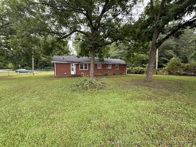 102 Little Street Rockingham, NC 28379 - Photo 23 of 29 a view of a house with yard and sitting area