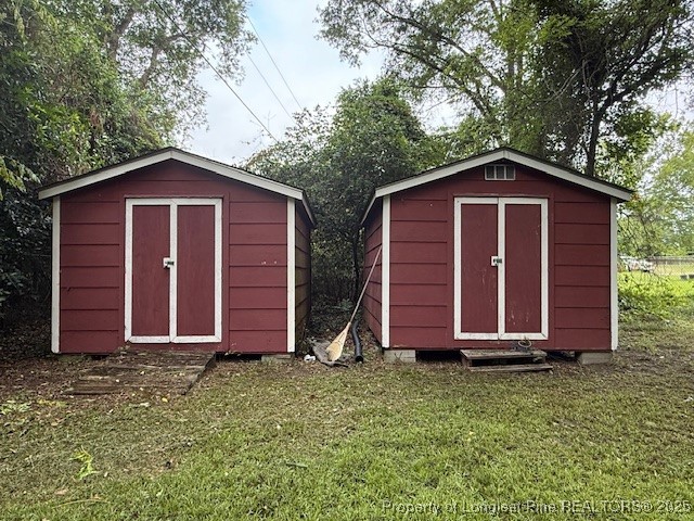 102 Little Street Rockingham, NC 28379 - Photo 24 of 29 a view of barn house with a yard