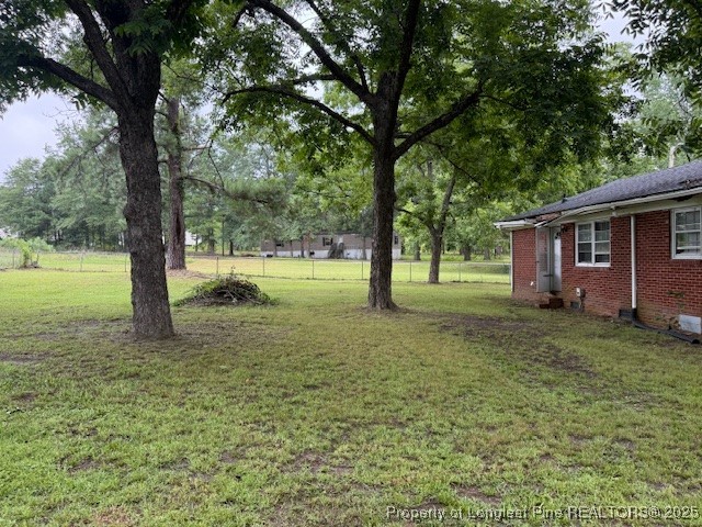 102 Little Street Rockingham, NC 28379 - Photo 26 of 29 a view of outdoor space with deck and yard