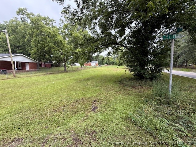 102 Little Street Rockingham, NC 28379 - Photo 3 of 29 a backyard of a house with table and chairs