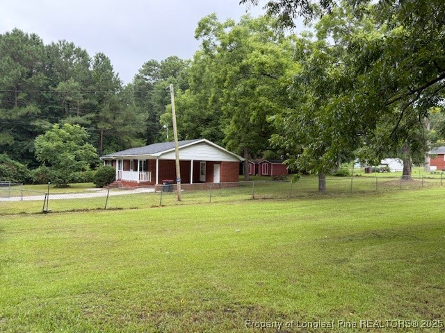 102 Little Street Rockingham, NC 28379 - Photo 4 of 29 a view of a swimming pool with a yard
