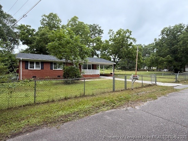 102 Little Street Rockingham, NC 28379 - Photo 6 of 29 a view of a house with backyard and trees
