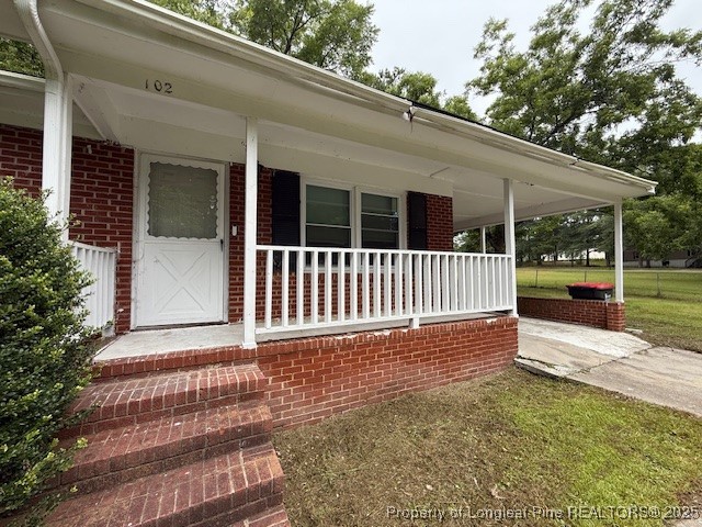102 Little Street Rockingham, NC 28379 - Photo 9 of 29 a view of a house with a yard