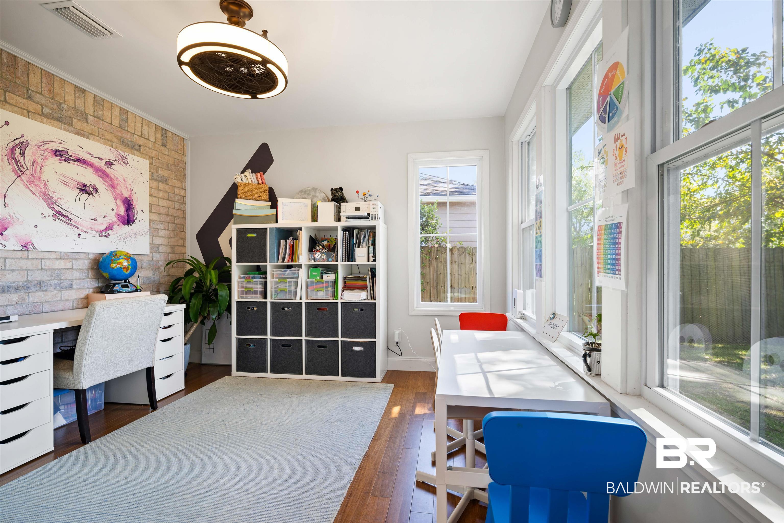 808 Michigan Avenue Fairhope, AL 36532 - Photo 27 of 33 Home office featuring brick wall, plenty of natural light, and dark hardwood / wood-style flooring