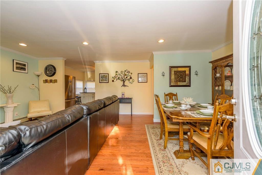 68 Sturgis Road Edison, NJ 08817 - Photo 2 of 25 a living room with stainless steel appliances kitchen island granite countertop furniture and a rug