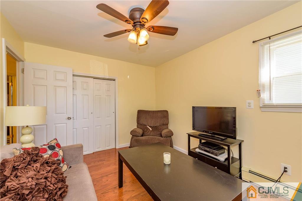 68 Sturgis Road Edison, NJ 08817 - Photo 13 of 25 a bedroom with furniture and a flat screen tv
